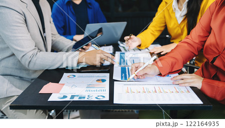 Business people making presentation with his colleagues and business smartphone, tablet digital computer Business people making presentation with his colleagues and business smartphone, tablet digital computer 122164935