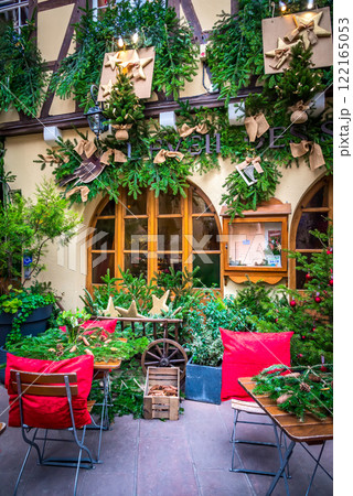 Strasbourg, France - 03rd December 2017 - Street cafe with winter decorations, Marche de Noel travel destination in Alsace. Strasbourg, France - 03rd December 2017 - Street cafe with winter decorations, Marche de Noel travel destination in Alsace. 122165053