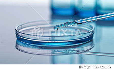 Sterile blue fluid in glass dish 122165085