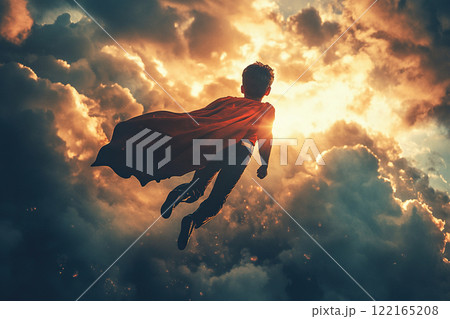 A boy dressed as a superhero with a red cape flies high in the clouds. Children's Day concept. 122165208