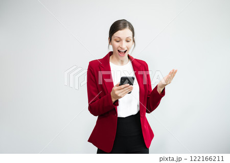 Confident Caucasian businesswoman CEO idea holding smartphone for remote work, online viewing, multitasking isolated 122166211