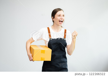 Caucasian woman smiling and holding package parcel box isolated on white background, Delivery and shipping service Caucasian woman smiling and holding package parcel box isolated on white background, Delivery and shipping service 122166322