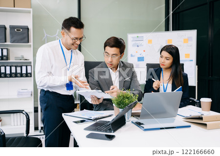 Happy businesspeople while collaborating on a new project in an office. Group of diverse businesspeople 122166660