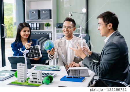 Business people having consultation about wind energy at company office. Business team discussing about windmill and alternative green enery. Net zero 122166781