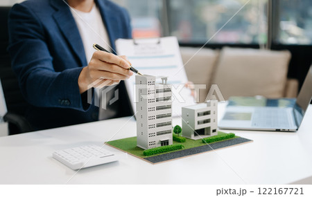 Considering buying a home, investing in real estate. Broker signs a sales agreement. agent, lease agreement, successful deal 122167721