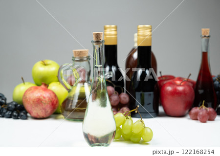 White wine vinegar in a vinegar bowl against the background of other types of bottled vinegars 122168254