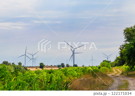 Wind turbines in a field. Renewable energy 122171034