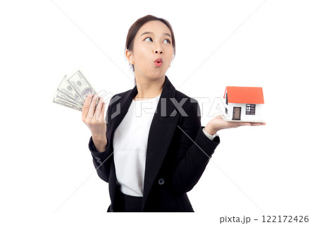 Portrait young asian businesswoman holding house and money for mortgage isolated. Portrait young asian businesswoman holding house and money for mortgage isolated. 122172426
