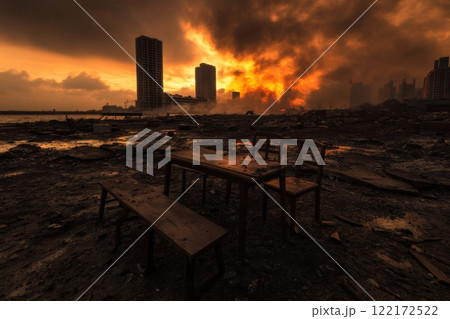 Abandoned furniture in destroyed cityscape at sunset against fiery background 122172522