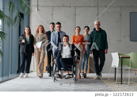 A diverse group of business professionals walking together through the office, symbolizing unity and strength as a collaborative and successful team A diverse group of business professionals walking together through the office, symbolizing unity and strength as a collaborative and successful team 122172613