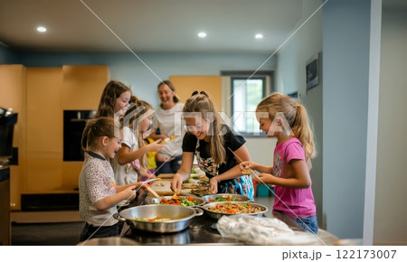 Children Enjoy Cooking and Learning Together in a Fun and Interactive Kitchen Class. Generated image 122173007