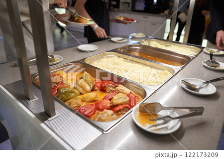 A buffet with Russian dishes, which features traditional dishes in metal containers. With space to copy. High quality photo 122173209