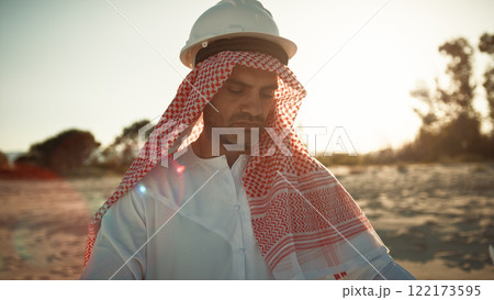 Sheik With Safety Helmet Reading The Project Map Sheik With Safety Helmet Reading The Project Map 122173595