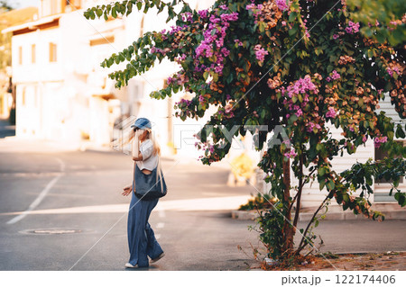 blonde girl in blue pants walking on the street in istanbul. tourist on princes islands in turkey 122174406