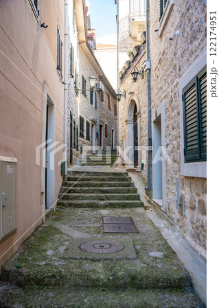 Narrow street without people in old town of Herceg Novi in Montenegro in winter time Narrow street without people in old town of Herceg Novi in Montenegro in winter time 122174951