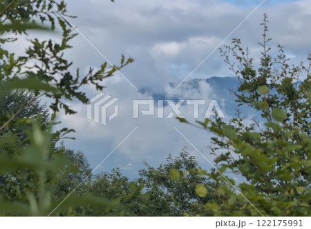 the mountain appears between clouds 122175991
