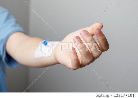Patient hand with Catheter. Medicine and hospital concept 122177101