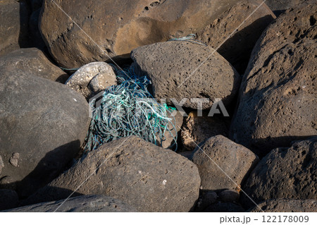 Volcanic rocks and fishing net, Lanzarote, Spain 122178009