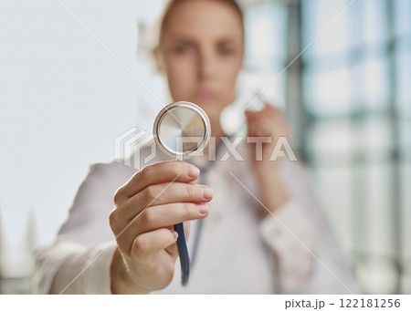 female physician healthcare professional showing medical equipme 122181256