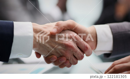 business partners confidently shaking hands. close up. business partners confidently shaking hands. close up. 122181305