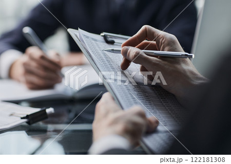 Financial Business man analyze the graph of the company's performance to create profits and growth 122181308