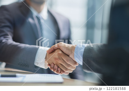 Businessman handshake for teamwork of business merger and acquisition Businessman handshake for teamwork of business merger and acquisition 122181588