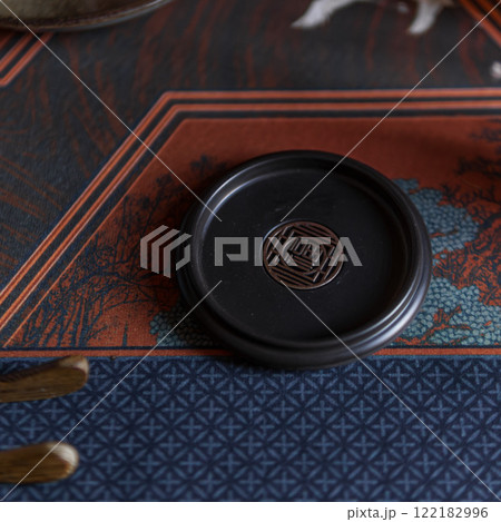 An Elegant Black Plate Perfectly Set Against a Stylish and Decorative Background An Elegant Black Plate Perfectly Set Against a Stylish and Decorative Background 122182996