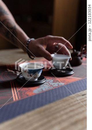 Enjoy an Elegant Tea Ceremony featuring beautifully Handcrafted Teacups for a soothing experience 122183034