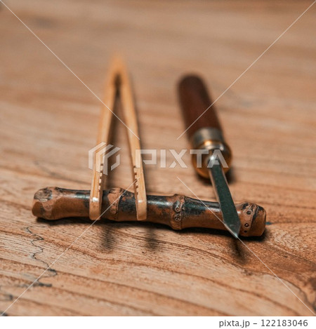 Beautiful, handcrafted woodworking tools displayed elegantly on a rustic wooden surface Beautiful, handcrafted woodworking tools displayed elegantly on a rustic wooden surface 122183046
