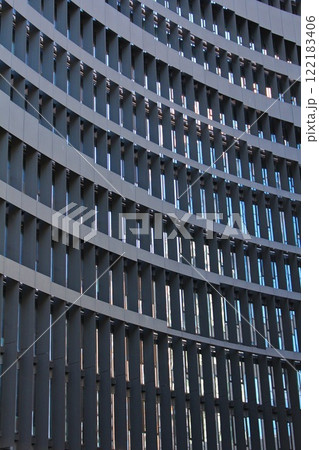 modern high rise office building with glass panoramic windows and metal architectural element in the business and financial district of the European capital during the day 122183406