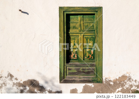 Iluminated green shutter window, Lanzarote, Spain 122183449