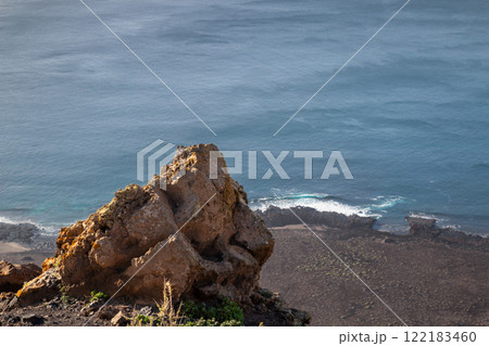 Rock on a cliff and Atlantic ocean, Lanzarote, Spain 122183460