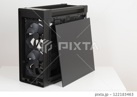 Side view of big tower, PC case, chassis, without upper , front, and glass left panel. Two pre-installed system extra-thick 200 x 38 mm front fans . On the side of case is placed right metal panel Side view of big tower, PC case, chassis, without upper , front, and glass left panel. Two pre-installed system extra-thick 200 x 38 mm front fans . On the side of case is placed right metal panel 122183463
