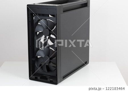 Side view of empty  big tower, PC case, chassis, without upper , front,  and  tempered-glass left  panel. Two  pre-installed system extra-thick 200 x 38 mm front fans 122183464