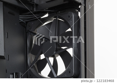 Empty big tower, PC case, chassis, close up of pre-installed extra-thick 200 x 38 mm front fan for maximum air intake. Without upper , front panel and tempered-glass left panel. Empty big tower, PC case, chassis, close up of pre-installed extra-thick 200 x 38 mm front fan for maximum air intake. Without upper , front panel and tempered-glass left panel. 122183468