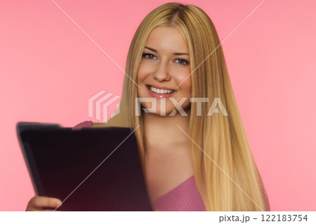 Woman, pink background and tablet, creativity and focus on ideas. Blonde beautiful woman, elegance and inspiration, working on designs and digital projects with style concept 122183754