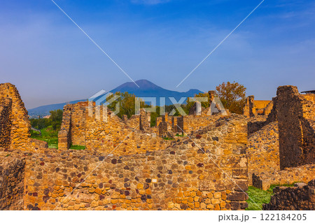 Ancient ruins of Pompei city, Naples, Italy. View of ancient street of Pompeii, Pompei is ancient Roman city destroyed from eruption of Mount Vesuvius in 1st century, Naples, Italy Ancient ruins of Pompei city, Naples, Italy. View of ancient street of Pompeii, Pompei is ancient Roman city destroyed from eruption of Mount Vesuvius in 1st century, Naples, Italy 122184205