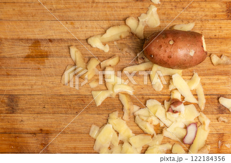 Partially Peeled Potato 122184356