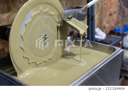 mechanism for processing pistachio and nut mousse. 122184464