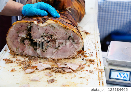 a large loaf of fresh farm ham and sausage ready for sale 122184466