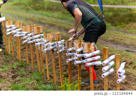 The start of the participant of the orienteering competition in the relay race during the rain. The start of the participant of the orienteering competition in the relay race during the rain. 122184844