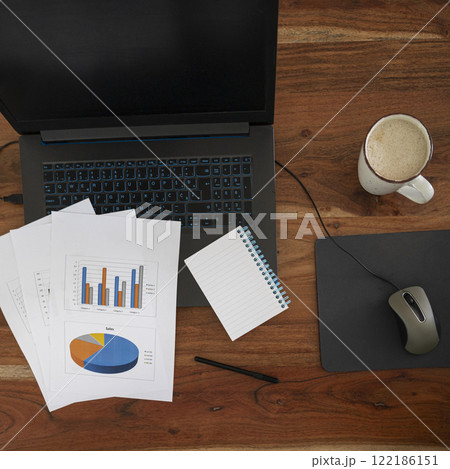 Business worspace with reports and coffee 122186151