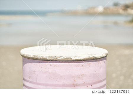 A pink oil barrel stands against the background of the sea. The natural scene shows an environmental problem. Water pollution. A natural disaster. With space to copy. High quality photo A pink oil barrel stands against the background of the sea. The natural scene shows an environmental problem. Water pollution. A natural disaster. With space to copy. High quality photo 122187015
