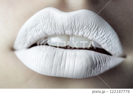 Beautiful female lips with white lipstick. Close-up shot. 122187778