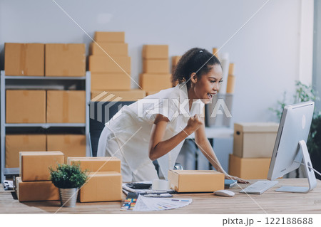 Portrait of Starting small businesses SME owners female entrepreneurs working on receipt box and check online orders to prepare to pack the boxes, sell to customers, SME business ideas online. 122188688