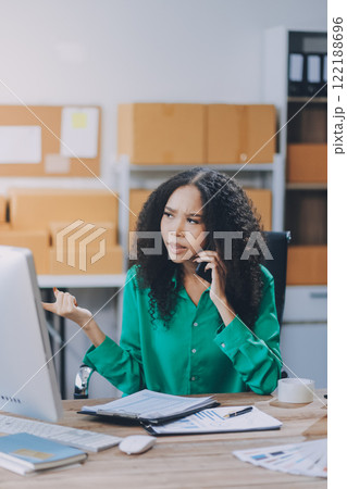 Portrait of Starting small businesses SME owners female entrepreneurs working on receipt box and check online orders to prepare to pack the boxes, sell to customers, SME business ideas online. 122188696