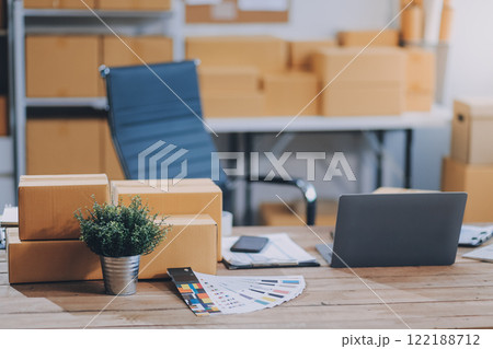 Portrait of Starting small businesses SME owners female entrepreneurs working on receipt box and check online orders to prepare to pack the boxes, sell to customers, SME business ideas online. 122188712