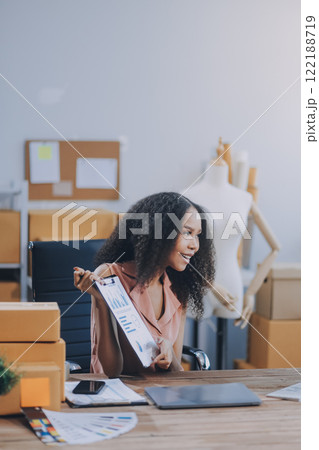 Portrait of Starting small businesses SME owners female entrepreneurs working on receipt box and check online orders to prepare to pack the boxes, sell to customers, SME business ideas online. 122188719