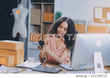 Portrait of Starting small businesses SME owners female entrepreneurs working on receipt box and check online orders to prepare to pack the boxes, sell to customers, SME business ideas online. 122188721
