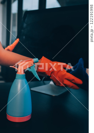 Janitor wiping table in office Janitor wiping table in office 122191998